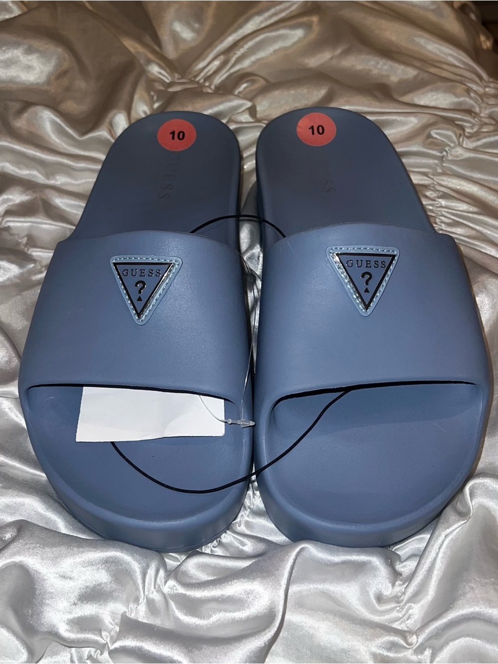Blue guess logo platform slides